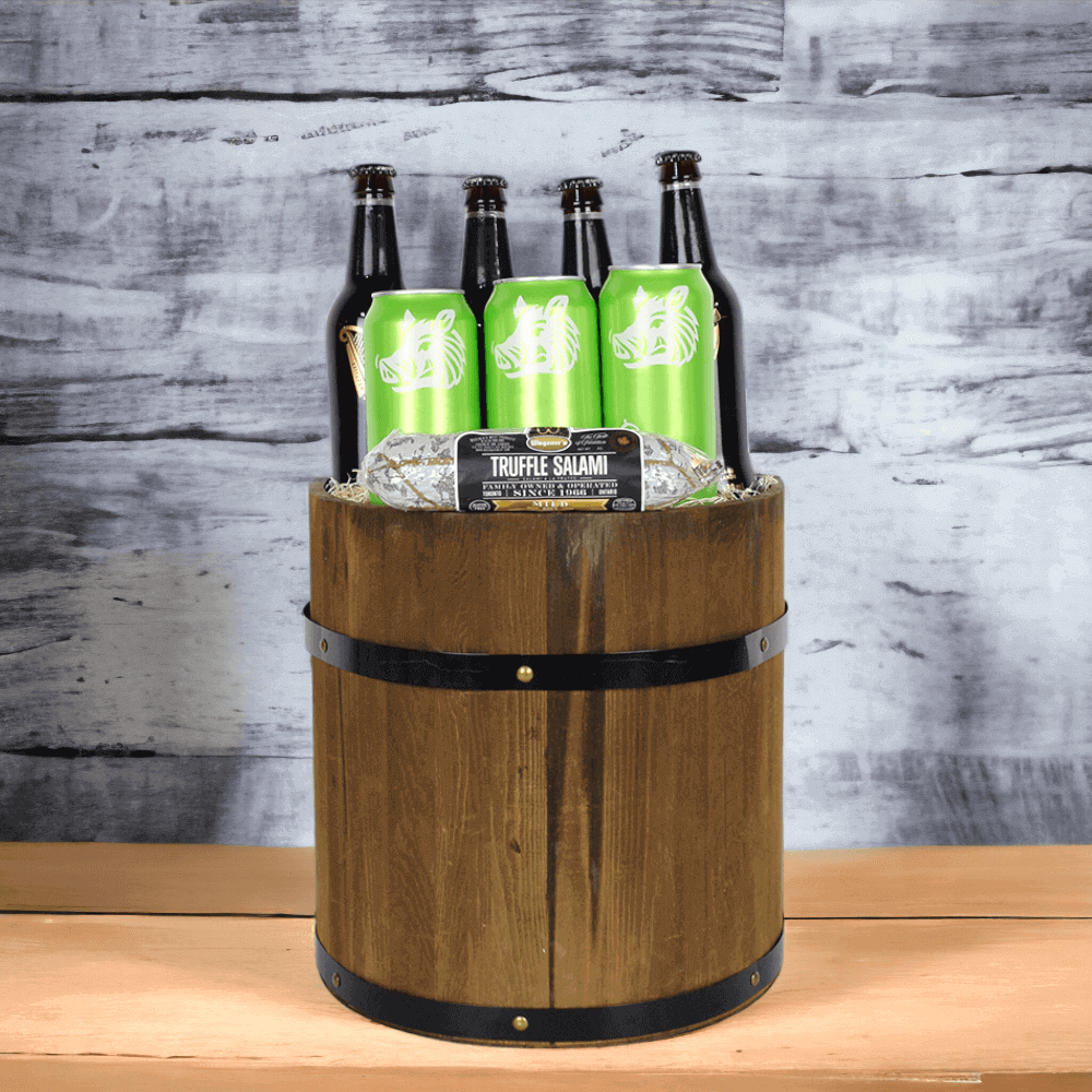 This gift basket includes 4 bottles of beer, 3 cans of craft beer and a stick of truffle salami from Wagener's, all in a beautiful rustic wooden barrel.