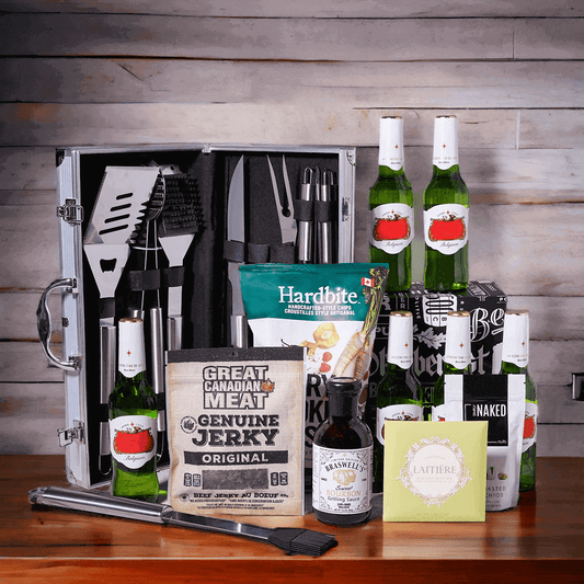 Included in this gift are chipotle raspberry parsnip chips, a bar of chocolate, dry roasted pistachios, classic beef jerky, sweet bourbon grilling sauce, a complete grilling tool set, and six beers packed into a beverage box.