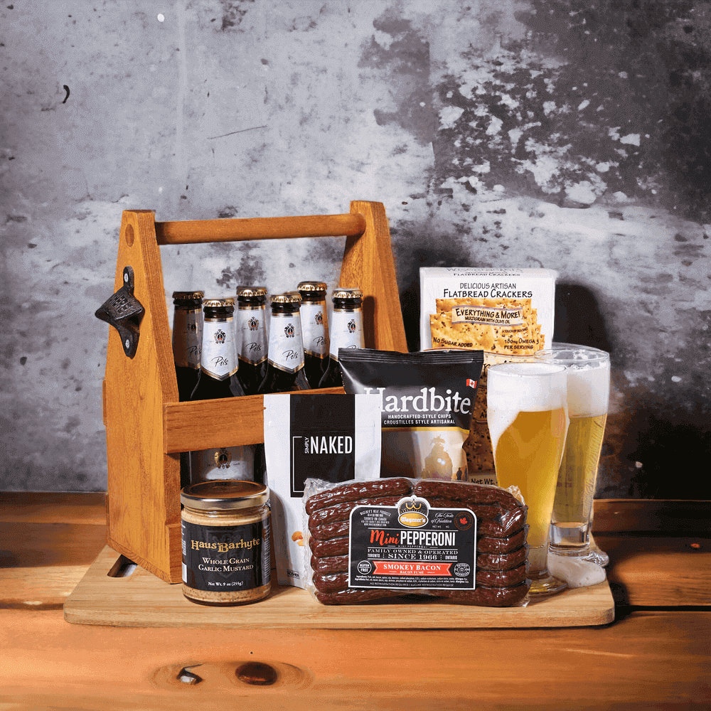 These include smokey bacon pepperoni sticks, six beers, crunchy sea salt cashews, chips, whole grain garlic mustard, crispy artisanal flatbread crackers, two tall beer glasses, and a six-slot wooden beverage carrier.